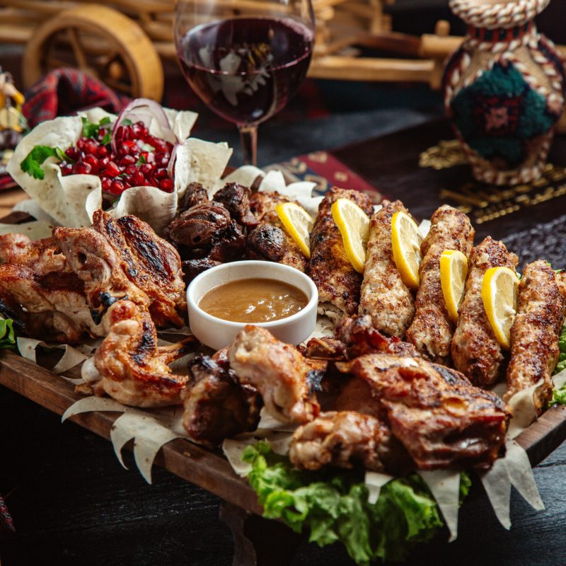 mixed fried meat with pomegranate and sauce